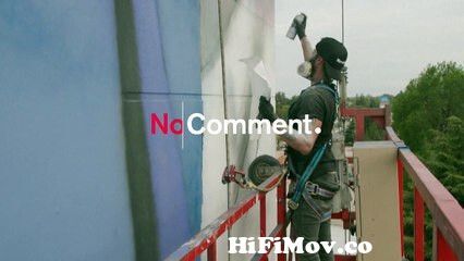View Full Screen: artist creates 40 meter high mural of football icon diego maradona.mp4
