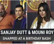 Sanjay Dutt and Mouni Roy were recently spotted at Anand Pandit&#39;s birthday bash. The party was attened by Mouni Roy in a beautiful off white satin gown with a thigh hgih slit and Sanjay Dutt was dressed in his casual look. Watch the video to know more.