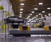 See more movies at www.dezeen.com/moviesnnOnline retail giant Amazon has presented a prototype for a service that uses flying robots to deliver packages to customers within half an hour of ordering.nnThe service would be called Amazon Prime Air and would be available to customers living within a ten mile radius of one of Amazon&#39;s distribution centres.nnThe unmanned aerial vehicles are called