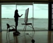This short documentary follows Howth based artist , Una Sealy RHA. Una has previouly painteda large winter painting, of a view ofClontarf, This winter Una choose Baldoyle estuary, an iconic place from her youth as her subject matter. Over a period of months from December 2015 , Una is seen worked from the large meeting room of the award winningBaldoyle Library, designed by FKL Architects,on Strand Road, which commands excellent views of Irelands Eye, and the estuary in all its changing moo