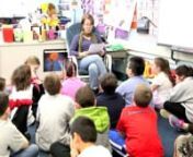 Cindy Clifford from WALK RADIO 97.5 reads an original story to a fourth grade class at the Riley Avenue School during Parents as Reading Partners Reading Week.