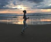 Get 100&#39;s of FREE Video Templates, Music, Footage and More at Motion Array: https://www.bit.ly/2UymF81nnnnGet this here: https://motionarray.com/stock-video/sunrise-exercise-142761nnThis clip follows a young woman as she bounces down the beach for an early morning jog. The girl is wearing a white sports bra, matching leggings, and headphones. She runs along the stiff wet sand as the waves push more water onto the shore. The sun is low in the sky. The freshly risen sun is painting the sky in bril