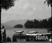 Members of the Preston Family on holiday in the Lake District.The film includes various landscape shots of Lake Windermere and the boating activitiesthat take place around the pier and lakeside.Concludes with footage of farm workers stacking hay on to a horse-drawn cart; farm animals grazing in the fields and a man and woman playing with some puppies in a garden.nnNWFA Film No. 1899nTitle: The Lake District WindermerenProducer: Preston BrothersnDate: *1931-33nb/w, silent, 16mmnnThis film i