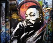 Muralist Brandalizm paints Martin Luther King Jr. in Graffiti Alley to honor his legacy.