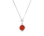 https://www.ross-simons.com/979386.htmlnnC. 1990. Presented by our Estate collection, this vibrant necklace is a remarkable way to get heads turning in your direction on a night out! The pendant beckons a bright hue of cherry red from the shiny 9.5mm round red coral cabochon, illuminated by a crescent of .40 ct. t.w. round brilliant-cut diamonds in platinum. Suspends from a 14kt white gold box chain. Lobster clasp, diamond and red coral pendant necklace. Exclusive, one-of-a-kind Estate Jewelry.