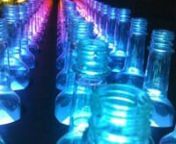 *No sound on video.nnA mobile LED bottle wall made from 253 Bacardi Breezer bottles for a Canada wide summer festival tour.nnBehind each bottle is an LED light controlled from an on-board computer.nnNot shown in the video are the empty cavities which the public is encouraged to fill with bottles to reveal the visuals.nnhttp://tangibleinteraction.comn@tangibleint