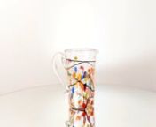 Buy now on: nhttps://www.yourmurano.com/en/murano-glassware-sets/blown-glass-carafes-pitchers/multicolor-spotted-crystal-pitchernnOriginal crystal Murano glass pitcher enriched with multicolor stains and black filaments. A real treasure for your dinners!nnHeightn22 cm / 8,66