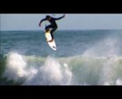 Josh Kerr surfs along with