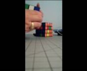Solving the Rubiks Cube with the 4x4 Rubiks Cube in the background giving me grief. Still working on solving it. Got down one time to two pieces out of place. Still working on it.