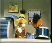 Sesame Street characters Ernie and Bert plays drums. The song is The Del-Lords track