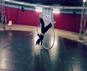 This woman showed her talent on a cyr wheel. She practiced multiple moves. The talented person successfully displayed her skills through her tricks.&#60;br/&#62;*The underlying music rights are not available for license. For use of the video with the track(s) contained therein, please contact the music publisher(s) or relevant rightsholder(s).