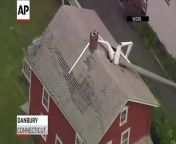 An electric glider crashed into the roof of a Danbury, Connecticut home on Tuesday. Mayor Mark Boughton and Danbury fire officials tell the Hartford Courant the glider&#39;s pilot suffered minor injuries. Three people in the home were not injured.