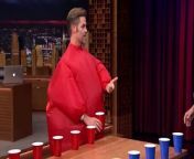 Jimmy competes against Chris Pine in a game of flip cup while wearing inflatable fat suits.