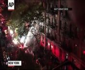An overnight blaze that tore through a five-story apartment building in Manhattan left one person dead and 12 civilians and firefighters injured, fire officials said