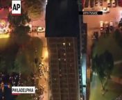 the WPVI-TV helicopter in Philadelphia shows a man scaling down the side of a high rise building during a fire on Thursday night.