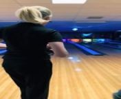 At a bowling alley, a man handed over a bowling ball to the woman, for her to strike. But unexpectedly when she was about to take a swing, the ball slipped from her hand and went flying backward towards the camera.&#60;br/&#62;&#60;br/&#62;The underlying music rights are not available for license. For use of the video with the track(s) contained therein, please contact the music publisher(s) or relevant rightsholder(s).