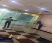 Amidst torrential rains in Aligarh, Uttar Pradesh, India, security guards at a mall struggled to keep two sets of glass doors open. As they fought against the sheer force of the intense winds, two people stranded in the rain hurried through the doors to shelter.